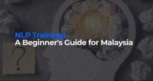 Text "NLP Training: A Beginner's Guide for Malaysia" over a profile silhouette of a head with a glowing lightbulb.