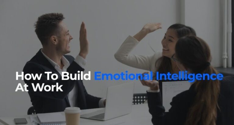 Photo of colleagues high-fiving, symbolic of how to build emotional intelligence